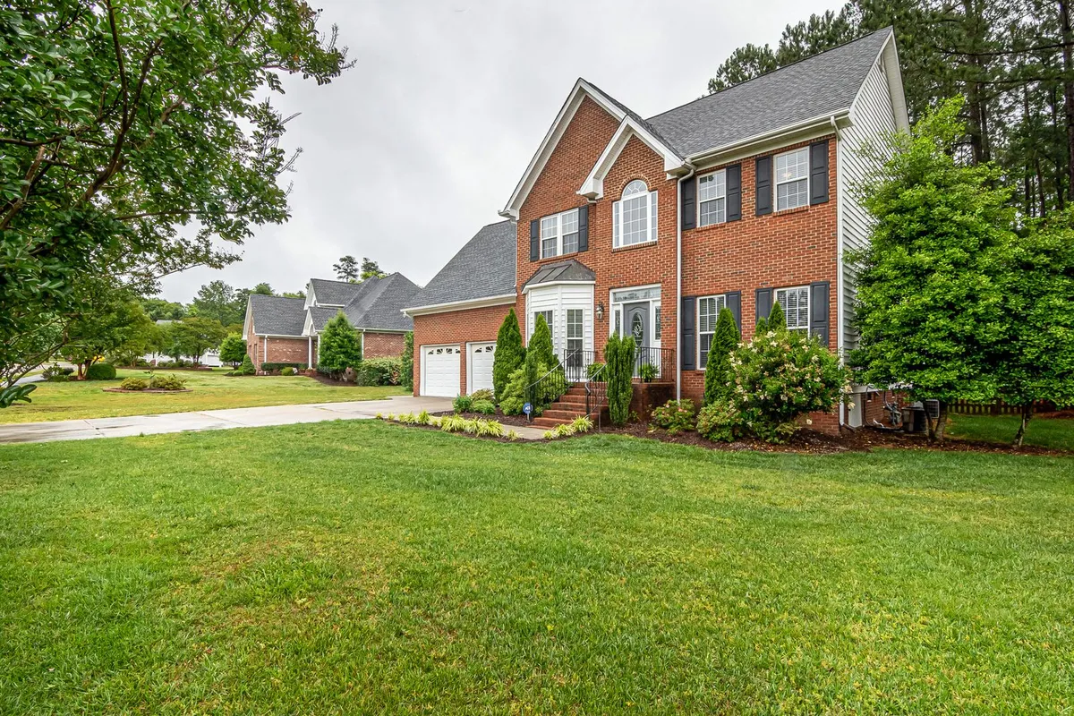 A well-kept backyard lawn and garden